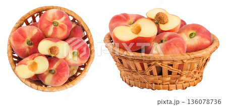 chinese flat donut peaches in a wicker basket isolated on white background. Top view. Flat lay chinese flat donut peaches in a wicker basket isolated on white background. Top view. Flat lay 136078736