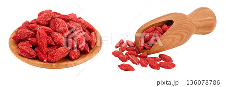Dried goji berries in wooden bowl and scoop isolated on white background with full depth of field Dried goji berries in wooden bowl and scoop isolated on white background with full depth of field 136078786