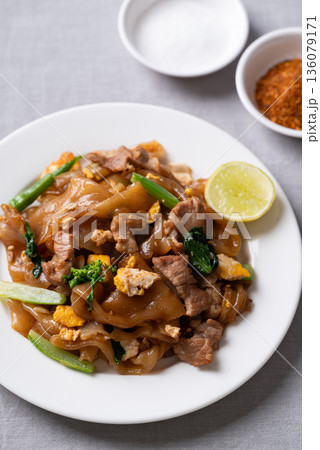 Thai food (Pad See Ew), Stir-fried rice noodles with soy sauce, pork, egg, and kale Thai food (Pad See Ew), Stir-fried rice noodles with soy sauce, pork, egg, and kale 136079171