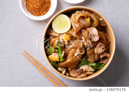 Thai food (Pad See Ew), Stir-fried rice noodles with soy sauce, pork, egg, and kale Thai food (Pad See Ew), Stir-fried rice noodles with soy sauce, pork, egg, and kale 136079176