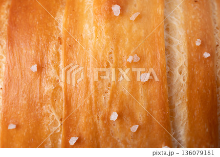Close up of Salt bread (Shio pan) with sea salt flakes, Japanese bakery style Close up of Salt bread (Shio pan) with sea salt flakes, Japanese bakery style 136079181