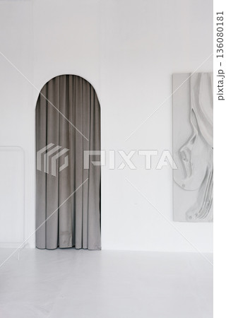 Bright Interior with Painting and Arched Passageway 136080181