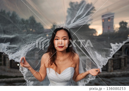 Chinese bride wearing white wedding dress and veil Chinese bride wearing white wedding dress and veil 136080253
