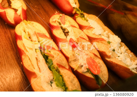Fresh gourmet baguette sandwiches in an authentic French boulangerie, offering delicious prepared food for lunch in Paris, France Fresh gourmet baguette sandwiches in an authentic French boulangerie, offering delicious prepared food for lunch in Paris, France 136080920