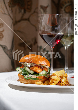 Shrimp burger with fries and wine pairing 136081407