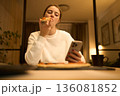 Soft Glow of the Phone in a Quiet Bedroom 136081852