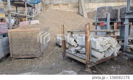 Labor environment featuring gravel mounds and packed masonry units Labor environment featuring gravel mounds and packed masonry units 136082178