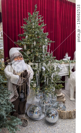 Holiday Tree Display, Decorative Holiday Arrangement With Santa Figure And Ornamental Embellishments Holiday Tree Display, Decorative Holiday Arrangement With Santa Figure And Ornamental Embellishments 136082518