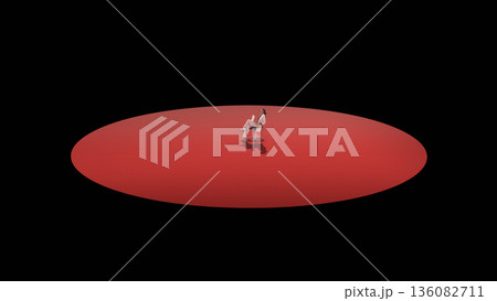 Dramatic mixed media business professional seated alone on red platform in dark space. 136082711