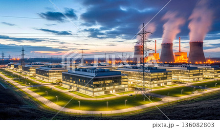 Aerial view of modern thermal power plant with cooling towers and office buildings at sunset with smoke steam energy industry infrastructure 136082803