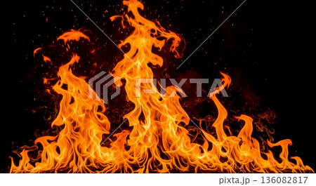 Bright orange fire flames isolated black background burning hot energy texture bonfire spark abstract design element wallpaper inferno danger concept Bright orange fire flames isolated black background burning hot energy texture bonfire spark abstract design element wallpaper inferno danger concept 136082817
