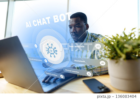 Person working on laptop with AI chat bot interface in modern office setting Person working on laptop with AI chat bot interface in modern office setting 136083404