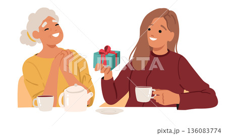 Cute heartwarming family breakfast scene with adult daughter giving gift to her elderly mother Cute heartwarming family breakfast scene with adult daughter giving gift to her elderly mother 136083774