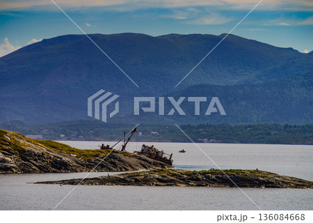 Norwegian coastline with fishing boat 136084668