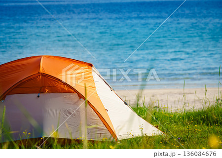 Seascape with tent on beach, Lofoten Norway Seascape with tent on beach, Lofoten Norway 136084676