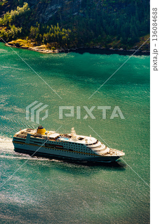Big cruise ship on fjord in Norway. Big cruise ship on fjord in Norway. 136084688