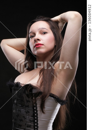 vintage brunette wearing corselette lingerie 136084912