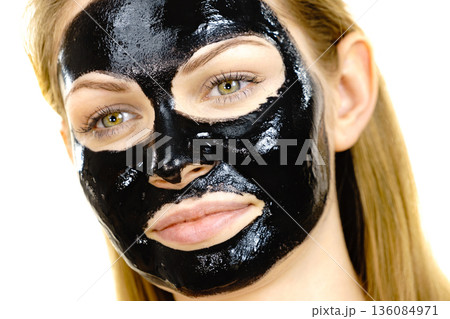 Girl black carbo peel off mask on face Girl black carbo peel off mask on face 136084971