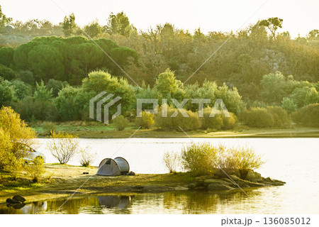Tent on lake shore. Camping on nature. Alentejo Portugal. 136085012