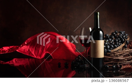 Red wine with grapes on a background of red flutters curtain. 136086567