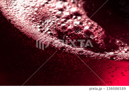 Red wine abstract splashing in glass. 136086589