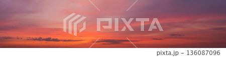 wide panorama of sunset clouds in the sky in summer evening wide panorama of sunset clouds in the sky in summer evening 136087096