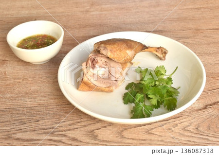 boiled duck meat and leg in black soybean sauce on plate dipping spicy chili sauce boiled duck meat and leg in black soybean sauce on plate dipping spicy chili sauce 136087318