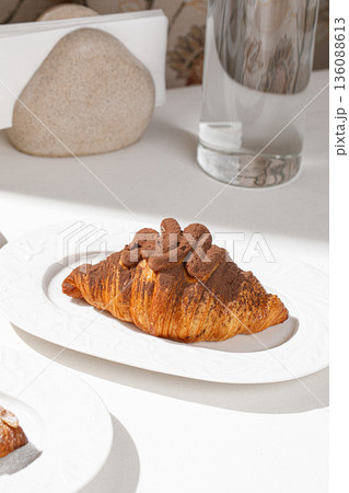 Chocolate croissant with cocoa cream Chocolate croissant with cocoa cream 136088613