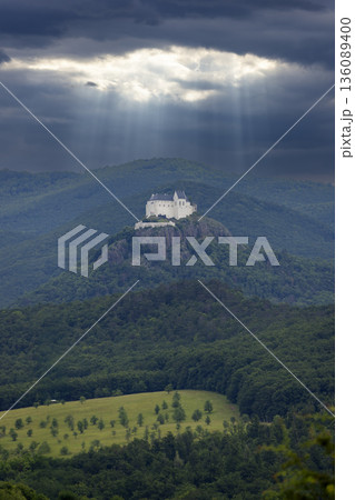 Fuzer Castle receiving sun rays through dramatic clouds Fuzer Castle receiving sun rays through dramatic clouds 136089400