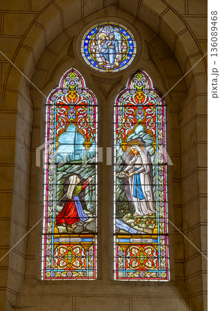 Stained glass window depicting Marian apparition in Auvillar church 136089468