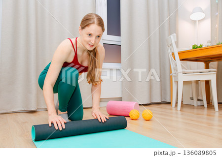 A woman doing fitness at home A woman doing fitness at home 136089805