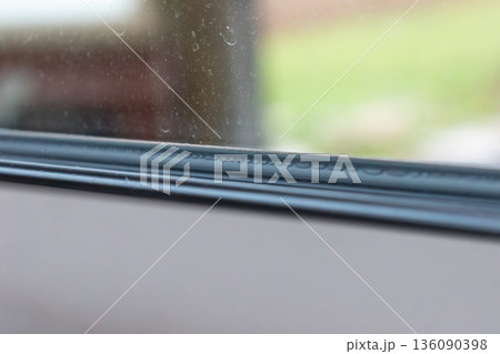 Moisture and dirt on a window 136090398
