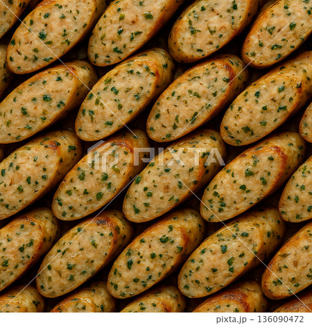 バジルが香る、斜め切りにして整然と敷き詰められたポークウインナーのテクスチャ 136090472