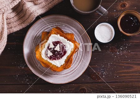 Sweet toasts with ricotta, berry jam and pastila on a plate on the table top view Sweet toasts with ricotta, berry jam and pastila on a plate on the table top view 136090521