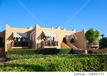 A luxury hotel in an Arabian resort with a green, lush garden and large grounds 136091337