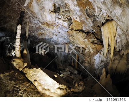 stalactites and stalagmites inside karst caves carved out by water 136091368