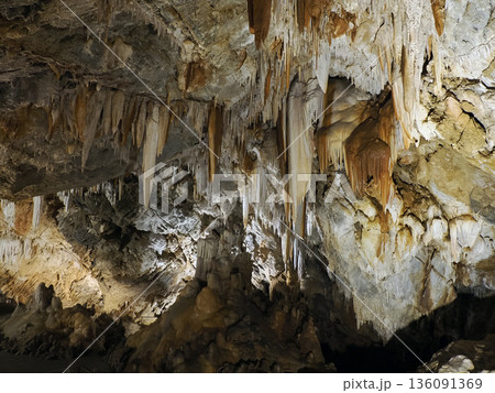 stalactites and stalagmites inside karst caves carved out by water 136091369