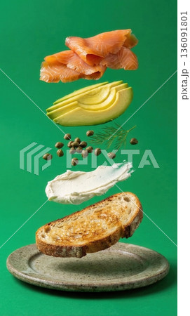 Deconstructed Salmon And Avocado Toast Ingredients green background 136091801