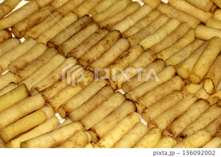 Gourmet spherical cut posh chips fries from putatoes close up in a line 136092002