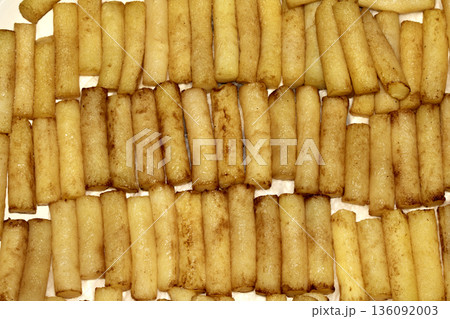 Gourmet spherical cut posh chips fries from putatoes close up in a line 136092003