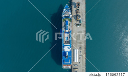 Aerial view luxury ocean cruise ship on clam blue sea, Elegant modern travel lifestyle, Luxury cruise ship liner modern maritime business ocean tourism, Global business cruise ship liner industry. Aerial view luxury ocean cruise ship on clam blue sea, Elegant modern travel lifestyle, Luxury cruise ship liner modern maritime business ocean tourism, Global business cruise ship liner industry. 136092317