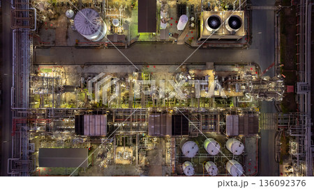 Aerial view Oil and Gas refinery plant at night, Global business energy logistic transportation, Oil and gas refinery petrochemical industrial, Petrochemical refinery industrial energy supply chain. Aerial view Oil and Gas refinery plant at night, Global business energy logistic transportation, Oil and gas refinery petrochemical industrial, Petrochemical refinery industrial energy supply chain. 136092376
