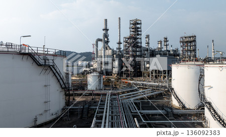 Aerial view oil and gas petrochemical tank with oil and gas refinery plant background, Global business power and energy petrochemical barrel, Petrochemical refinery industrial energy supply chain. 136092383