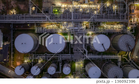 Aerial view Oil and Gas refinery plant at night, Global business energy logistic transportation, Oil and gas refinery petrochemical industrial, Petrochemical refinery industrial energy supply chain. 136092396