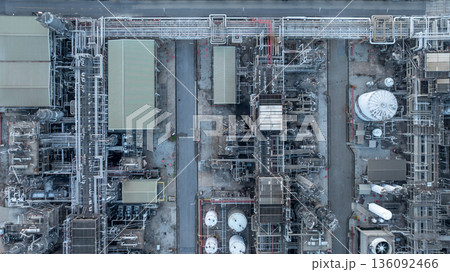 Aerial view oil and gas refinery petrochemical storage tank and pipeline steel, Oil and gas transportation system pipeline steel at oil and gas refinery industry chemical plant, Pipeline oil and gas. Aerial view oil and gas refinery petrochemical storage tank and pipeline steel, Oil and gas transportation system pipeline steel at oil and gas refinery industry chemical plant, Pipeline oil and gas. 136092466