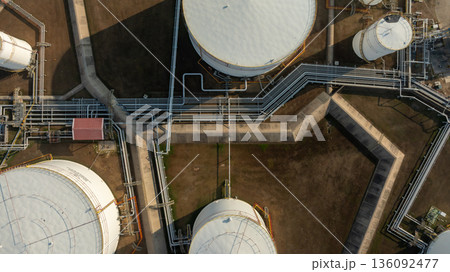 Aerial view of oil and gas petrochemical storage tank and pipeline steel, Oil and gas transportation system pipeline steel at oil and gas refinery industry petrochemical plant, Pipeline oil and gas. Aerial view of oil and gas petrochemical storage tank and pipeline steel, Oil and gas transportation system pipeline steel at oil and gas refinery industry petrochemical plant, Pipeline oil and gas. 136092477