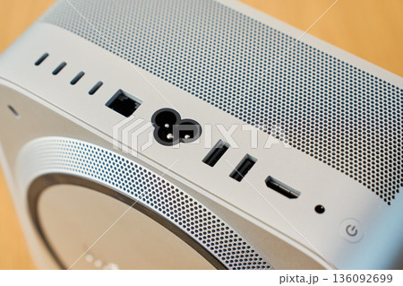 Rear ports of compact desktop computer with multiple connectors 136092699