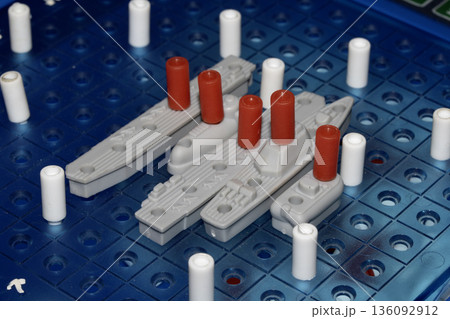 Close up of strategic battleships board game with ships and pegs Close up of strategic battleships board game with ships and pegs 136092912