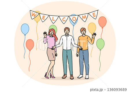 Welcome party from happy family welcoming friends into new apartment with balloons to celebrate move 136093689