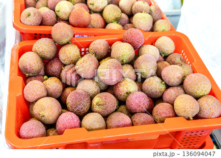 Fresh sweet lychee are sold at the grocery store Fresh sweet lychee are sold at the grocery store 136094047